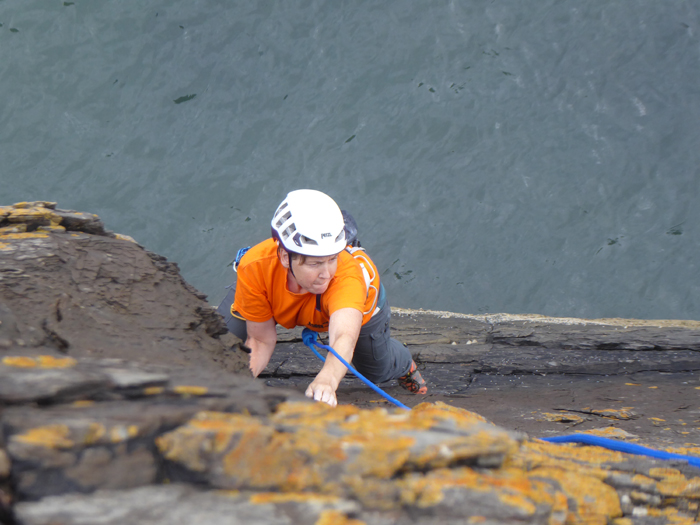 Linda climbing Soul Kitchen, E1 5a, on the Sea Buttress at Portobello. 