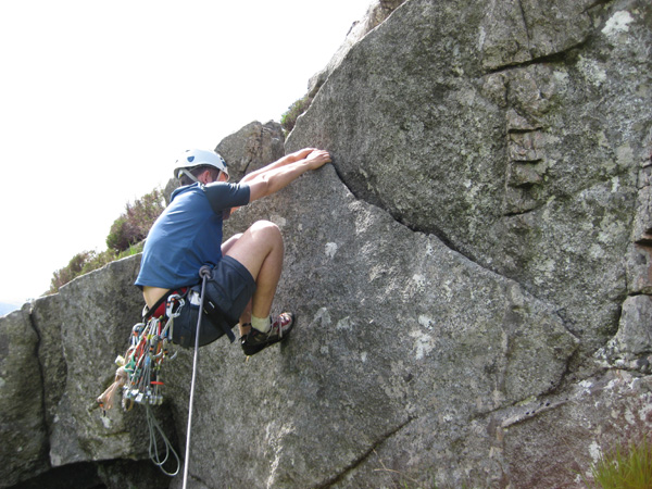 Ian Brown tries to stay cool on the awkward mantleshelf that kicks off Icebergs, Newfoundland Slab.