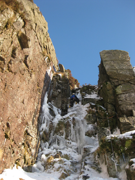 Linda Biggar above the crux on Gorm, grade III, 4, in January 2010, Craig-an-Eilte, Galloway