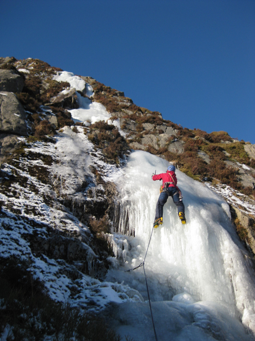 Linda Biggar climbing on pure ice, Cairnsmore of Fleet, Galloway. 