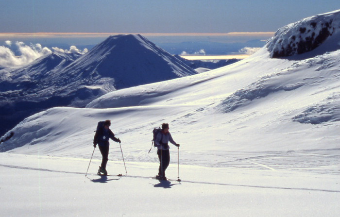 Skiing up Ruapehu, with Ngaurahoe in the background.